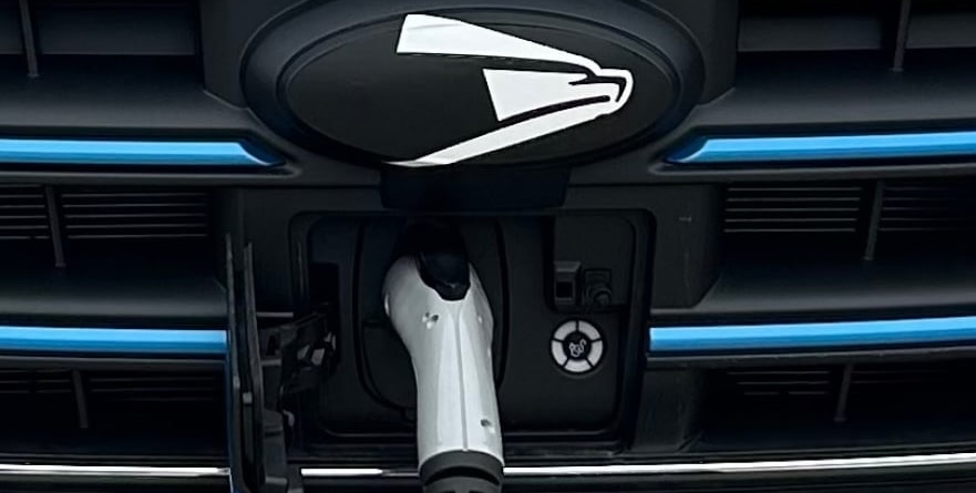 Featured image for "USPS Unveils Largest Electric Vehicle Fleet in the US with Ford E-Transit Vans and New EV Chargers"