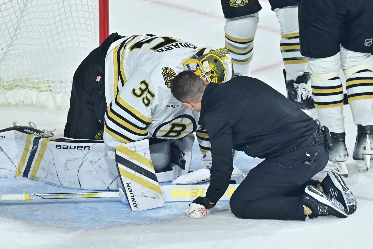 Featured image for "Bruins' Ullmark and Poitras Exit Game with Injuries in Loss to Coyotes"