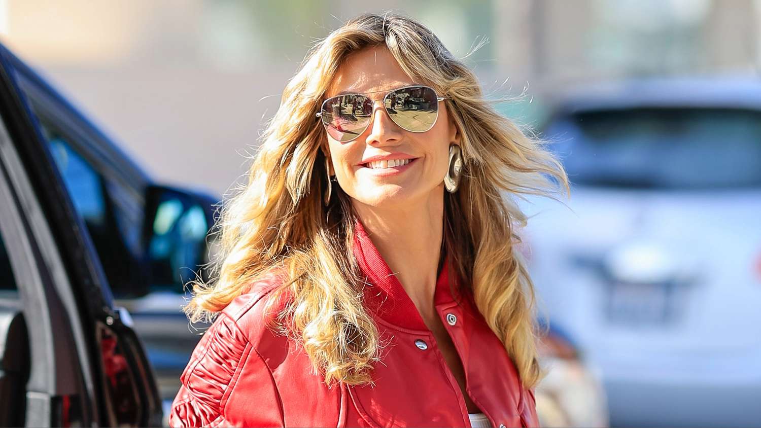 "Heidi Klum Channels Michael Jackson's 'Thriller' with Red Leather Ensemble"