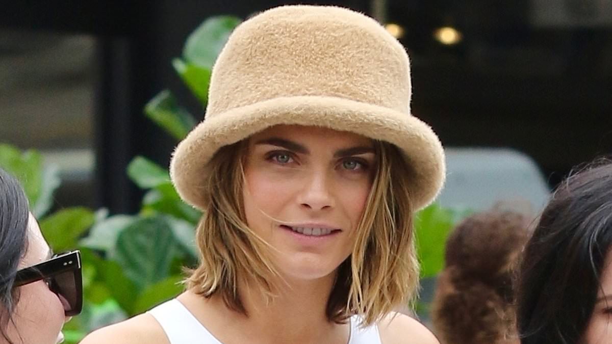 "Cara Delevingne's Effortlessly Cool Manhattan Style: Khaki Cargos and a Beige Faux-Fur Hat"