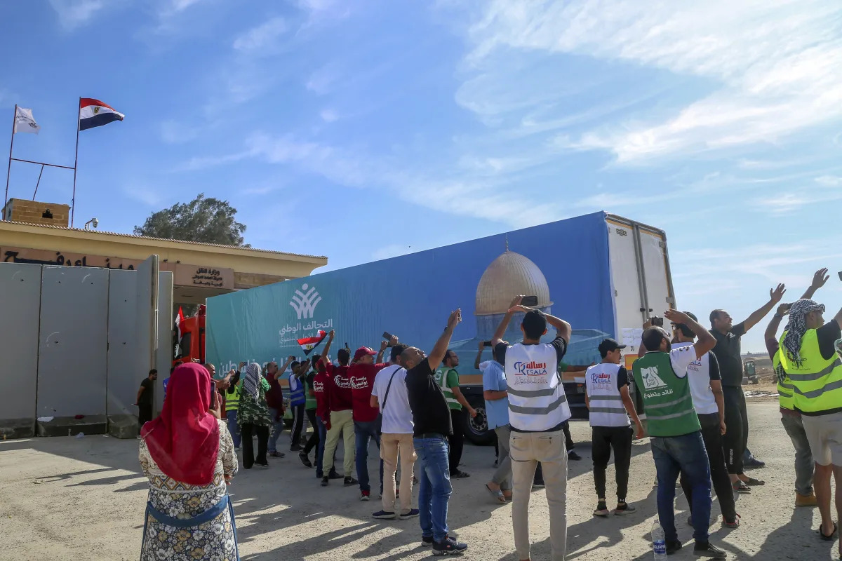"Desperately needed aid trickles into besieged Gaza as Egypt's border crossing opens"