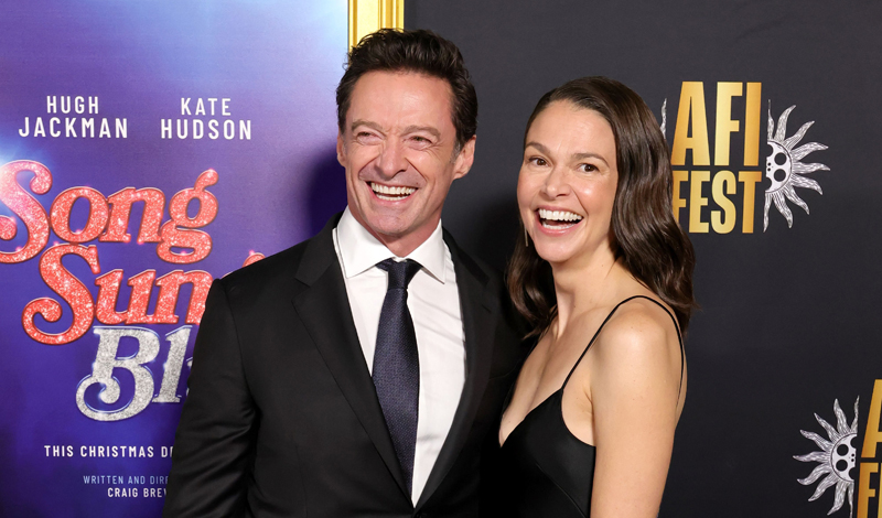 Featured image for Hugh Jackman and Sutton Foster Make Red Carpet Couple Debut at 'Song Sung Blue' Premiere