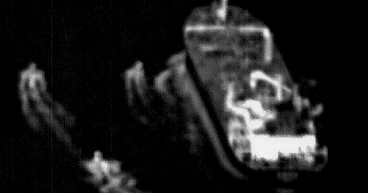 Iranian Revolutionary Guard boats harass commercial ship in Strait of Hormuz, US and UK navies respond.