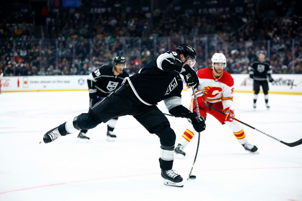 Kings dominate Flames with 8-2 win, move up in Pacific standings.