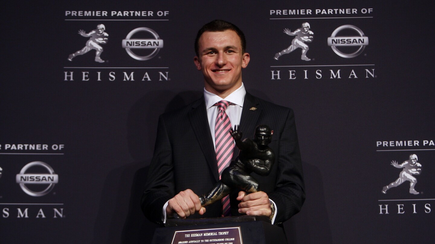 Featured image for "Johnny Manziel's Heisman Boycott Demands Reggie Bush's Trophy Return"