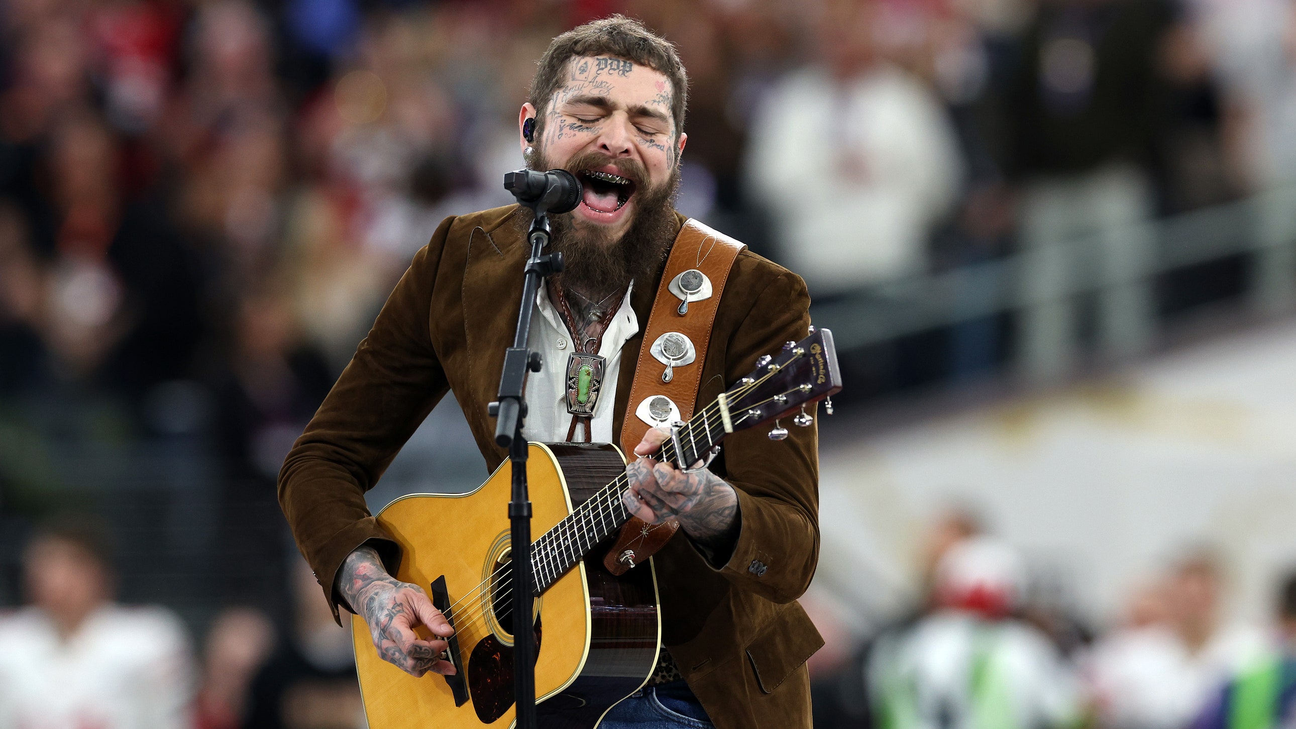 Featured image for Post Malone's Coolest Outfit Ever: The Best Menswear From Super Bowl 2024