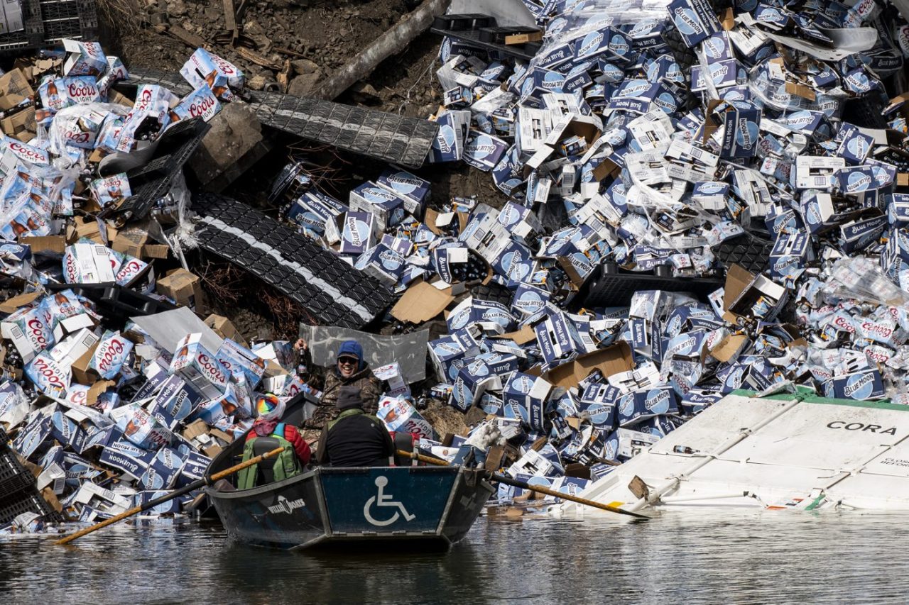 Montana train derailment spills Coors Light and Blue Moon beer into countryside.
