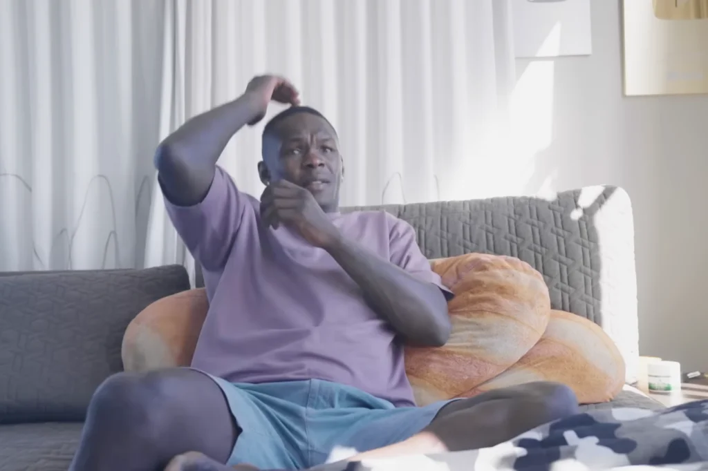 Adesanya Reacts from the Couch as Hooker Fades at UFC 325