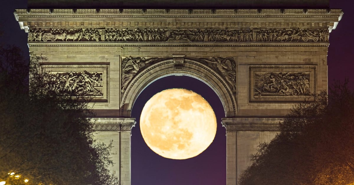 Stunning Photo Captures Full Moon Framed by Paris's Arc de Triomphe.