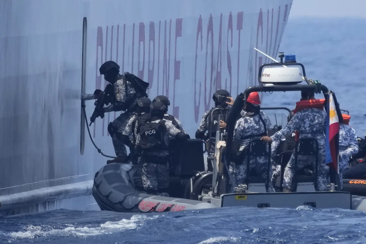 Coast guard ships conduct law enforcement drills in South China Sea.