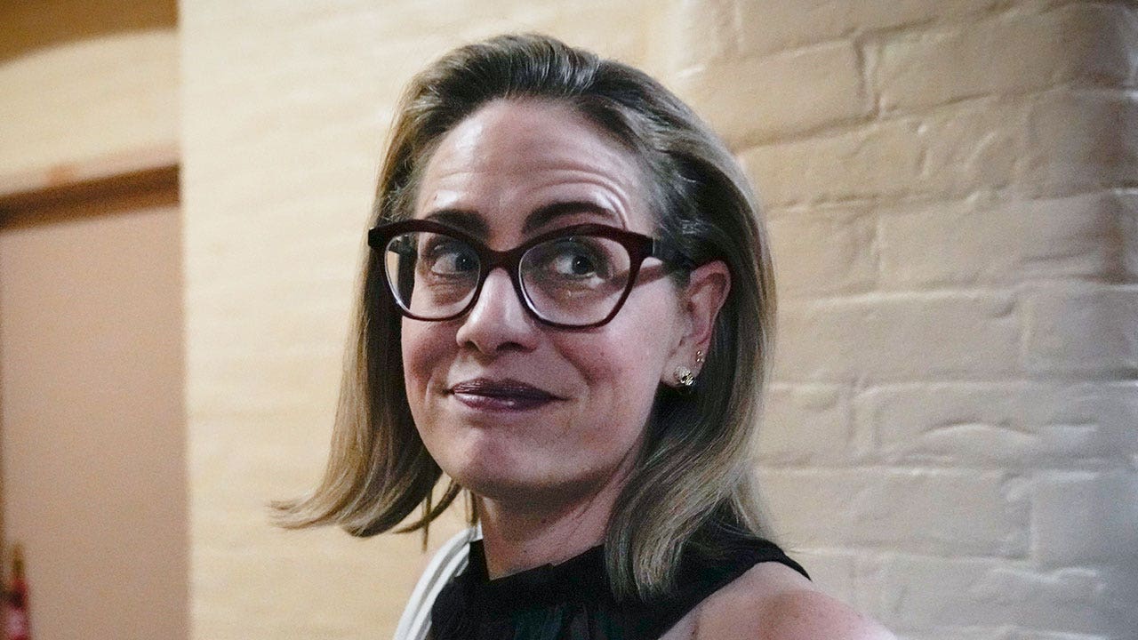 Sen. Kyrsten Sinema firmly rejects joining Republican party.