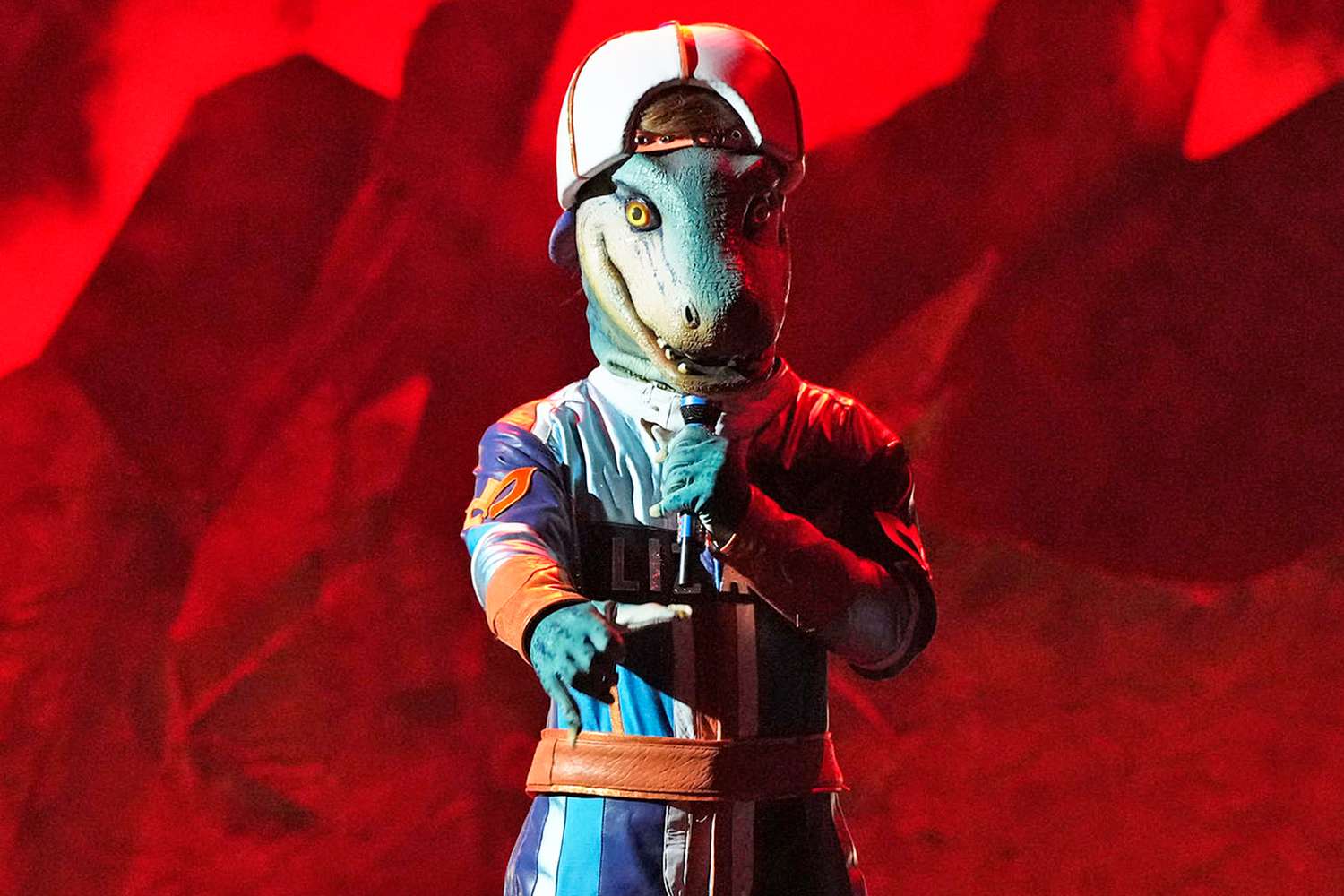 Featured image for 'Lizard Unmasked: The Masked Singer's 2000s R&B Star Revealed'