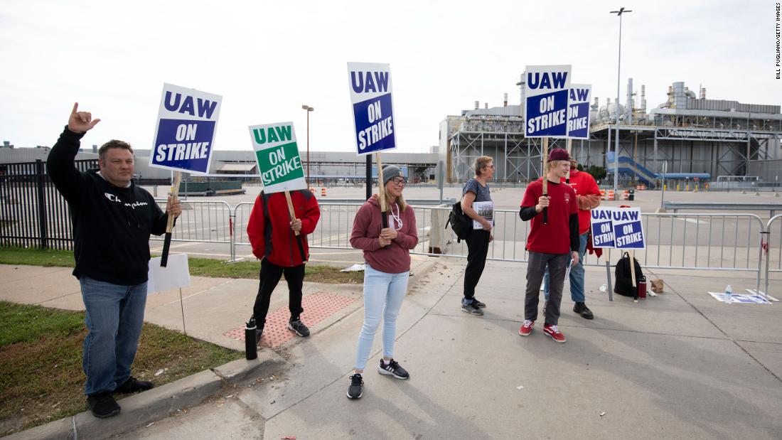 "UAW Strike Continues Amidst Layoffs and CEO Pay Debate"