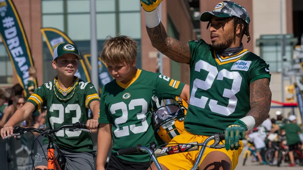 "Green Bay Packers and New England Patriots Join Forces for Intense Training Camp"