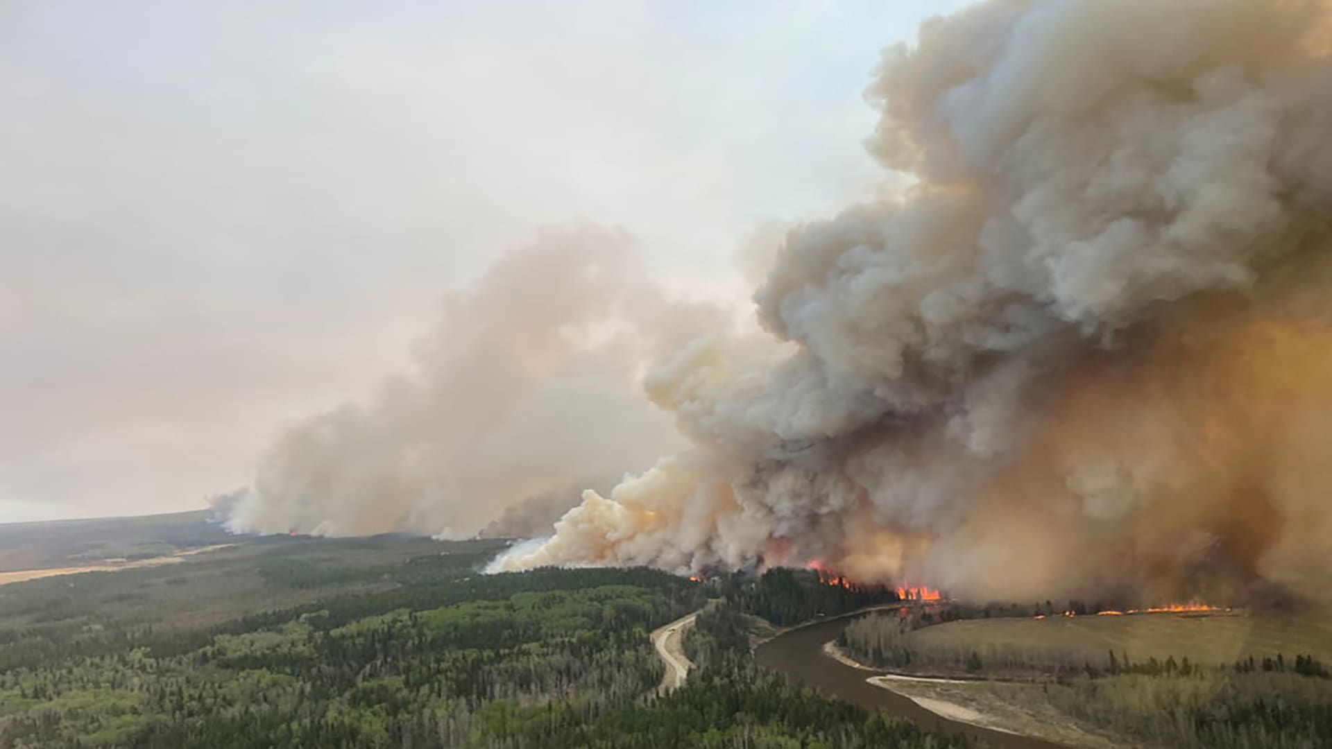 Wildfires force over 24,000 evacuations in Western Canada.