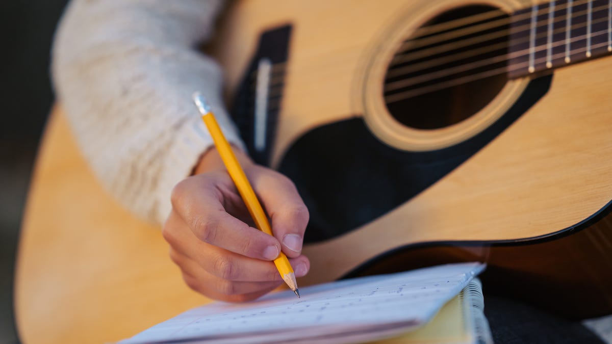 Featured image for "Terminal Serenade: Dying Musician's Last Song for 7-Year-Old Son Goes Viral"
