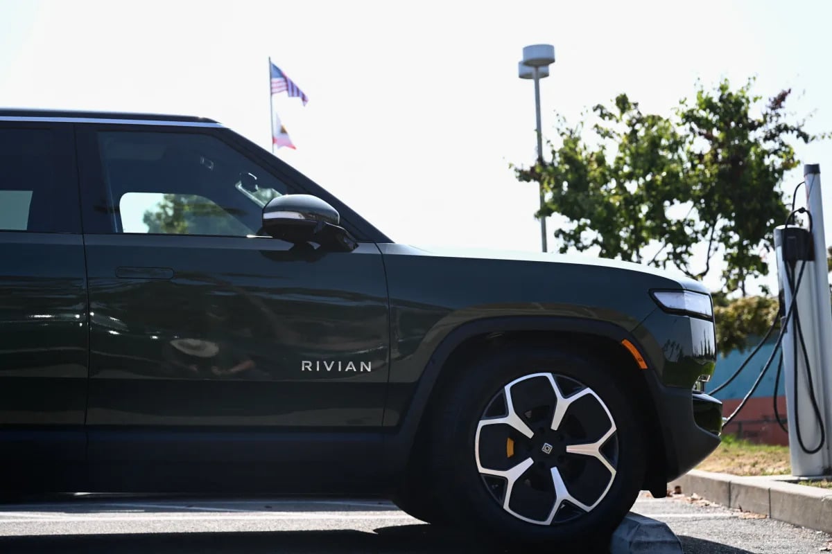 Featured image for Rivian Faces Challenges: Job Cuts and Pricing Pressure Amid EV Demand Shift