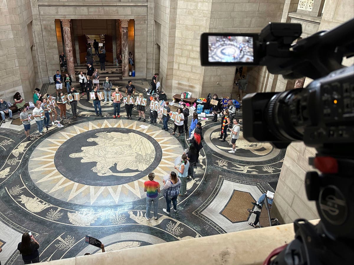 Nebraska lawmakers pass controversial abortion and transgender bills while shielding sick colleague.