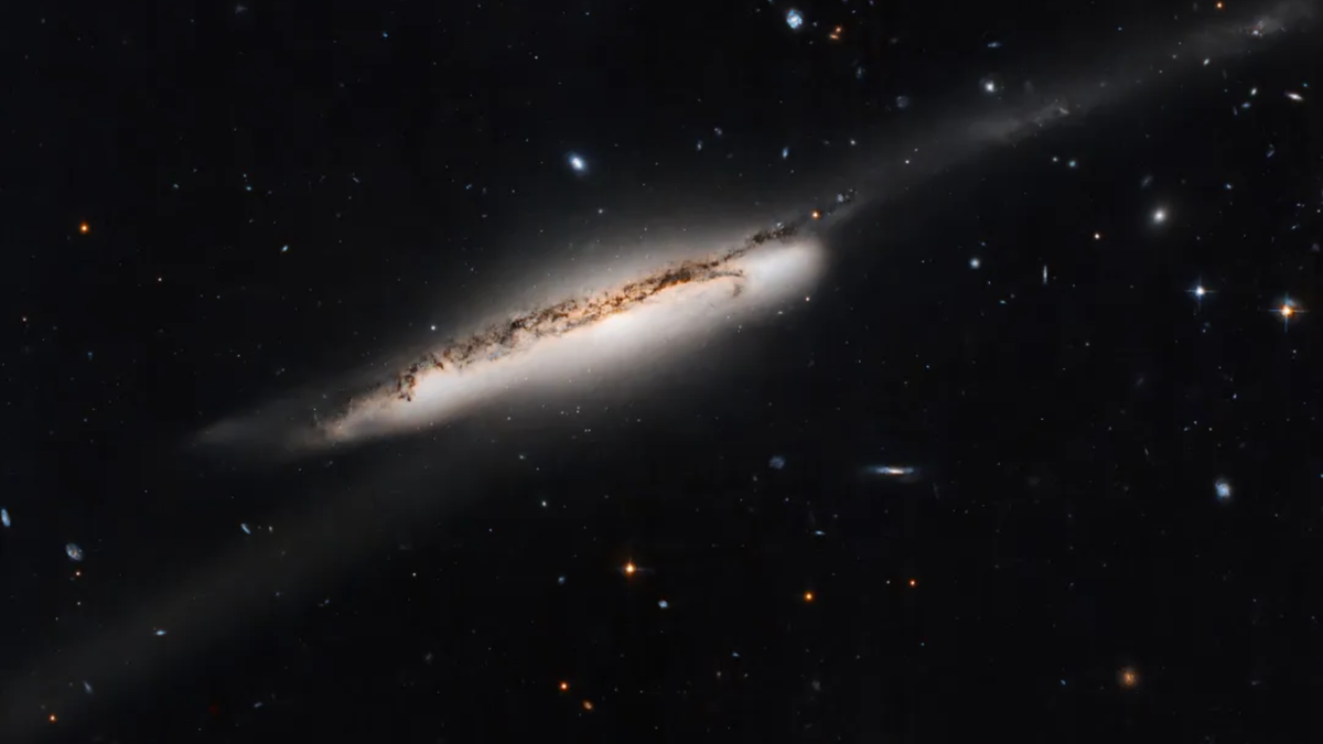 "Hubble Telescope Observes Spectacular Galaxy Bridge During Collision"