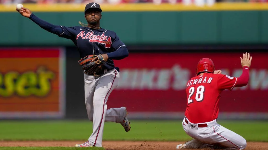 Braves snap Reds' historic 12-game win streak.