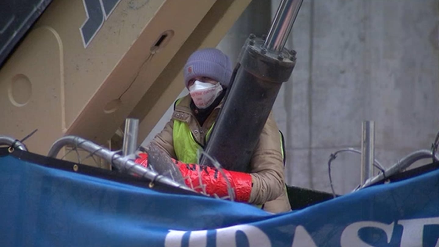 "Activists Chain Themselves to Construction Equipment in Midtown Atlanta Protest"