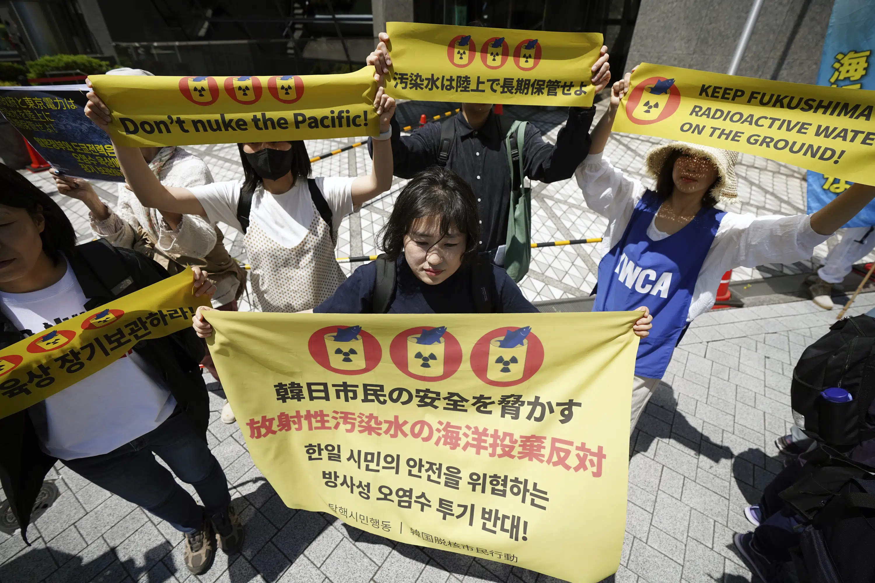 Protesters oppose Fukushima plant water release plan.