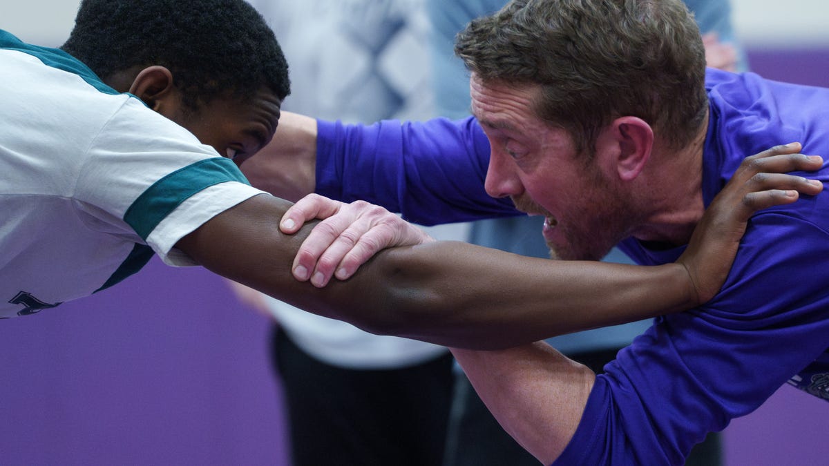 "Brownsburg Wrestling Coach Battles Rare Brain Infection: A Fight for Survival"