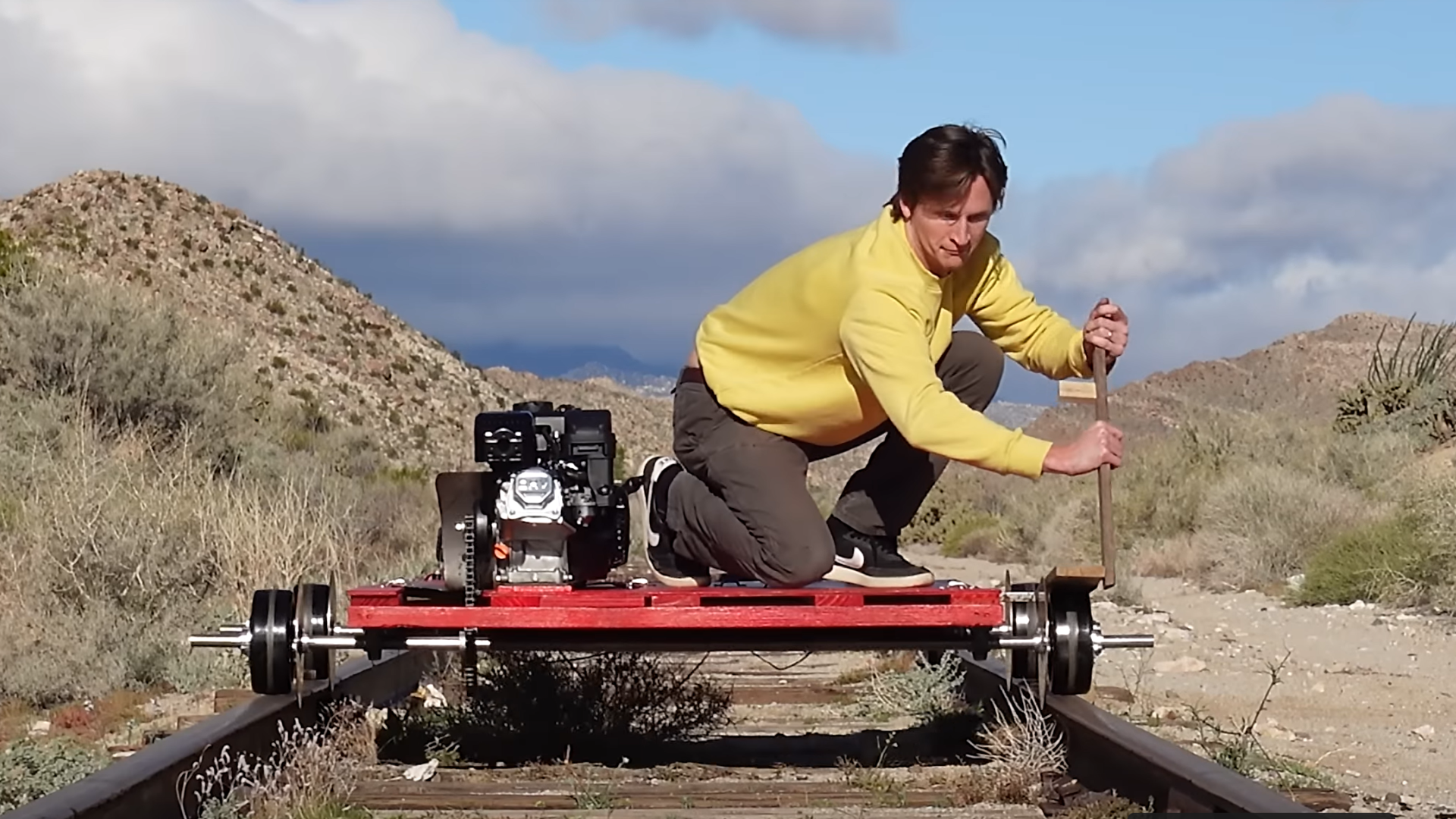 Featured image for "Adventurous YouTuber Explores Abandoned Train Bridge with Homemade Rail Go-Kart"