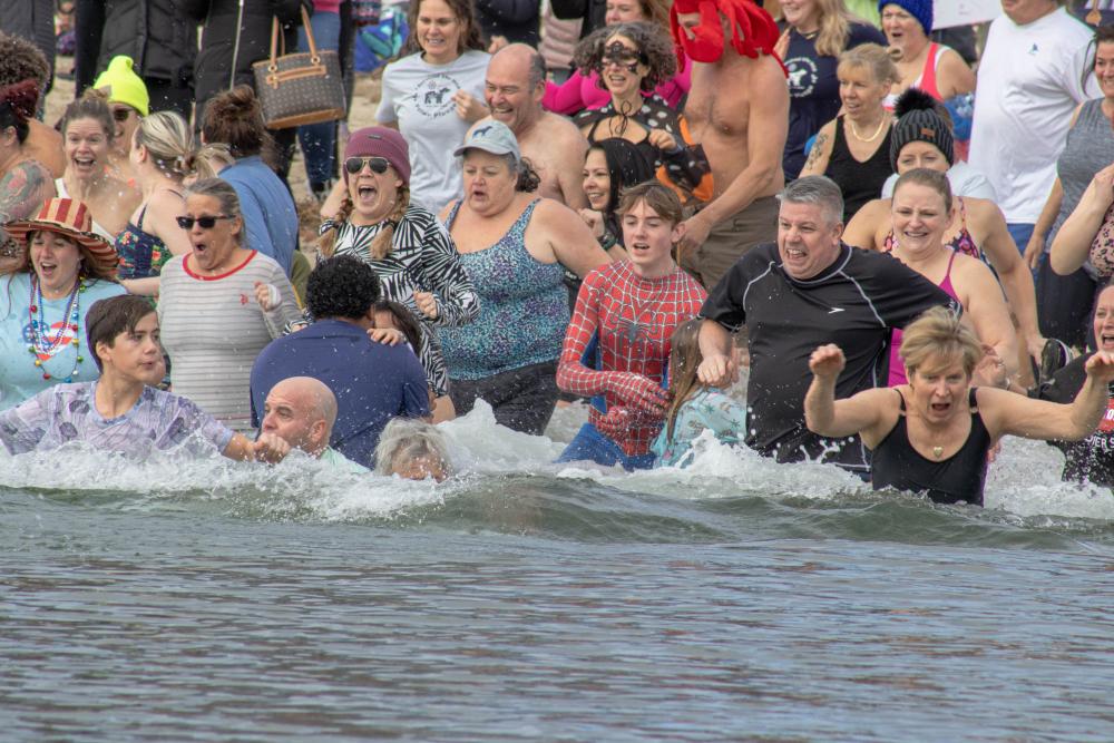 "Polar Bear Plunge Dives into 2024 with a Chilly Splash in Lake Michigan"