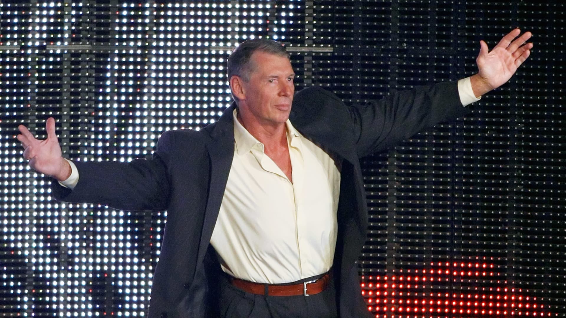 Vince McMahon renews WWE contract amidst potential sale.