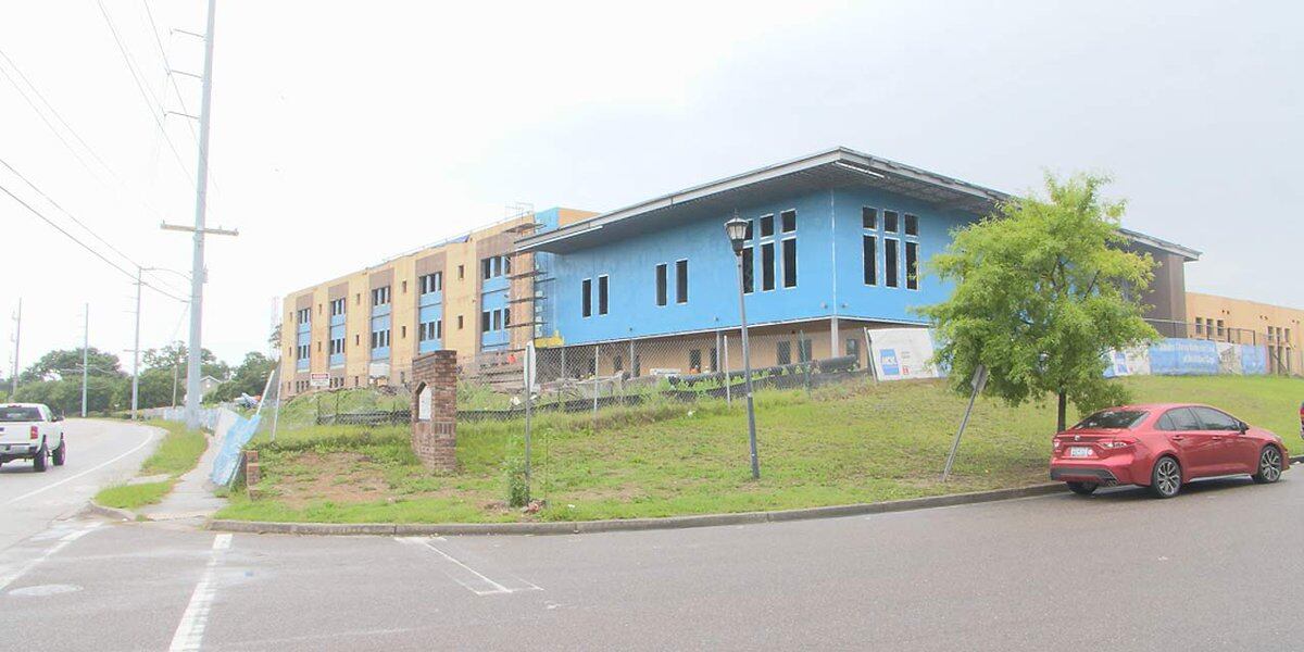 Possible article title: Weather May Delay Opening of North Charleston School.
