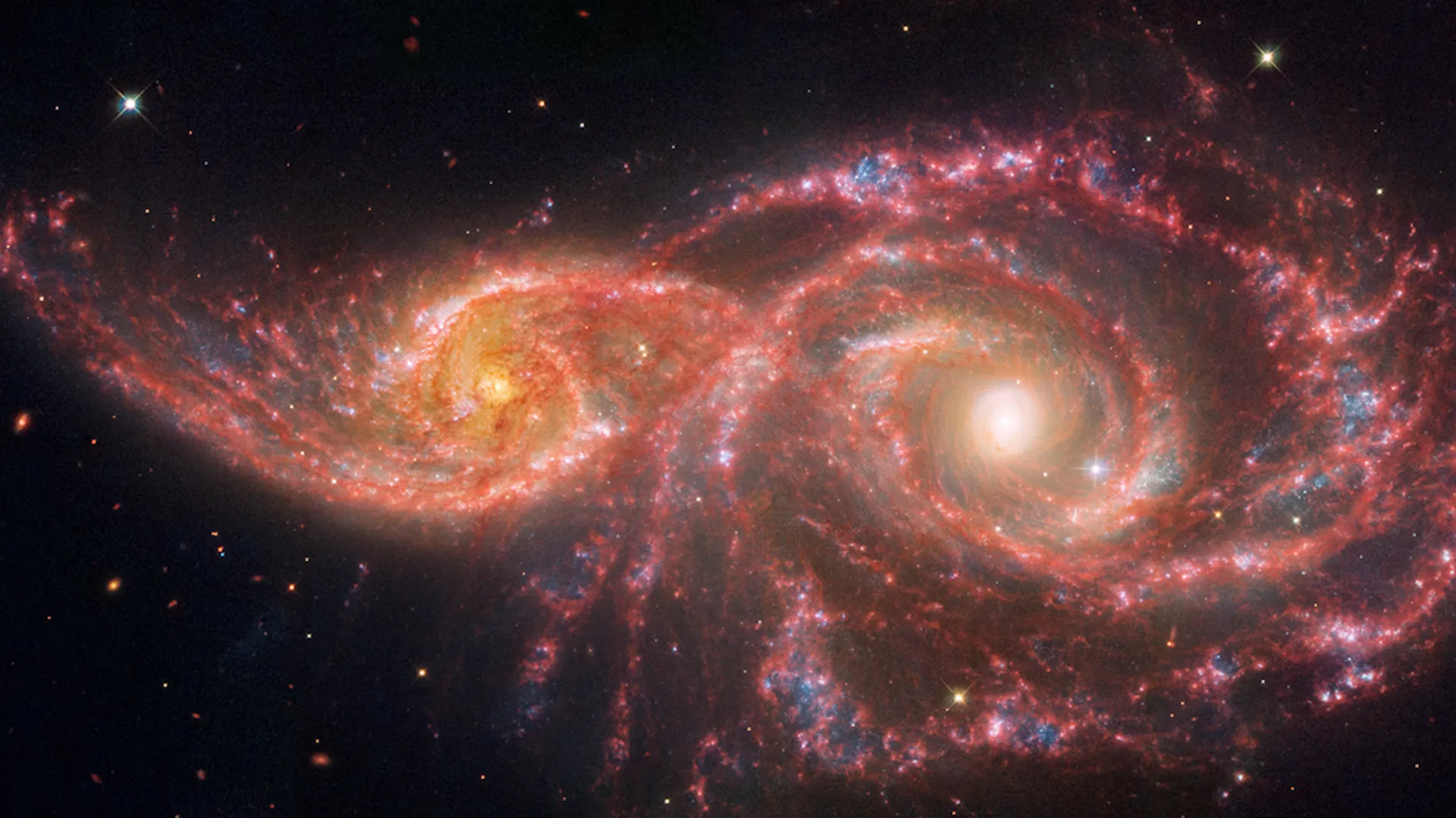 Featured image for NASA's Hubble and Webb Capture Eerie 'Blood-Soaked Eyes' Galaxies