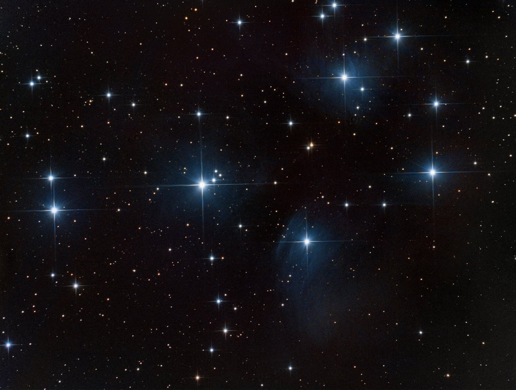 Celestial Spectacle: Pleiades and Leonid Meteor Shower Illuminate November Sky