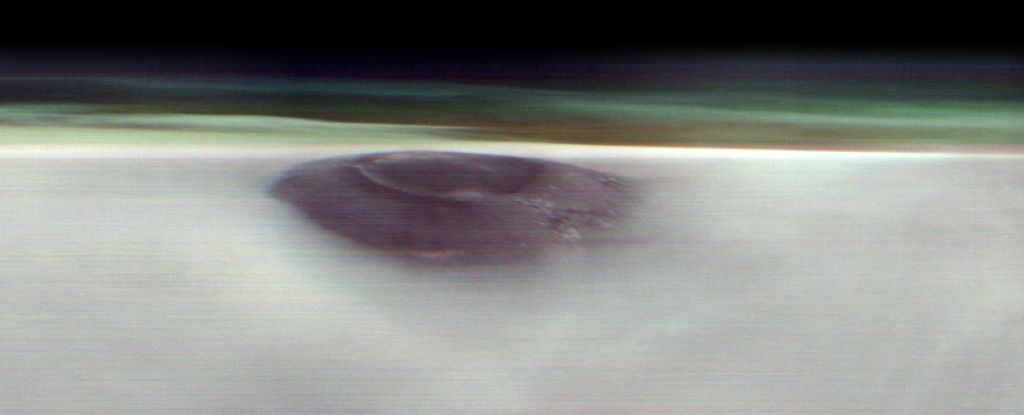 Featured image for NASA Captures Massive Martian Volcano Emerging Above Clouds