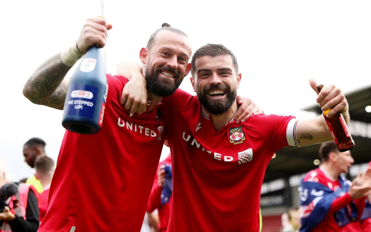Featured image for "Wrexham's Hollywood Promotion: Reynolds and McElhenney Celebrate"