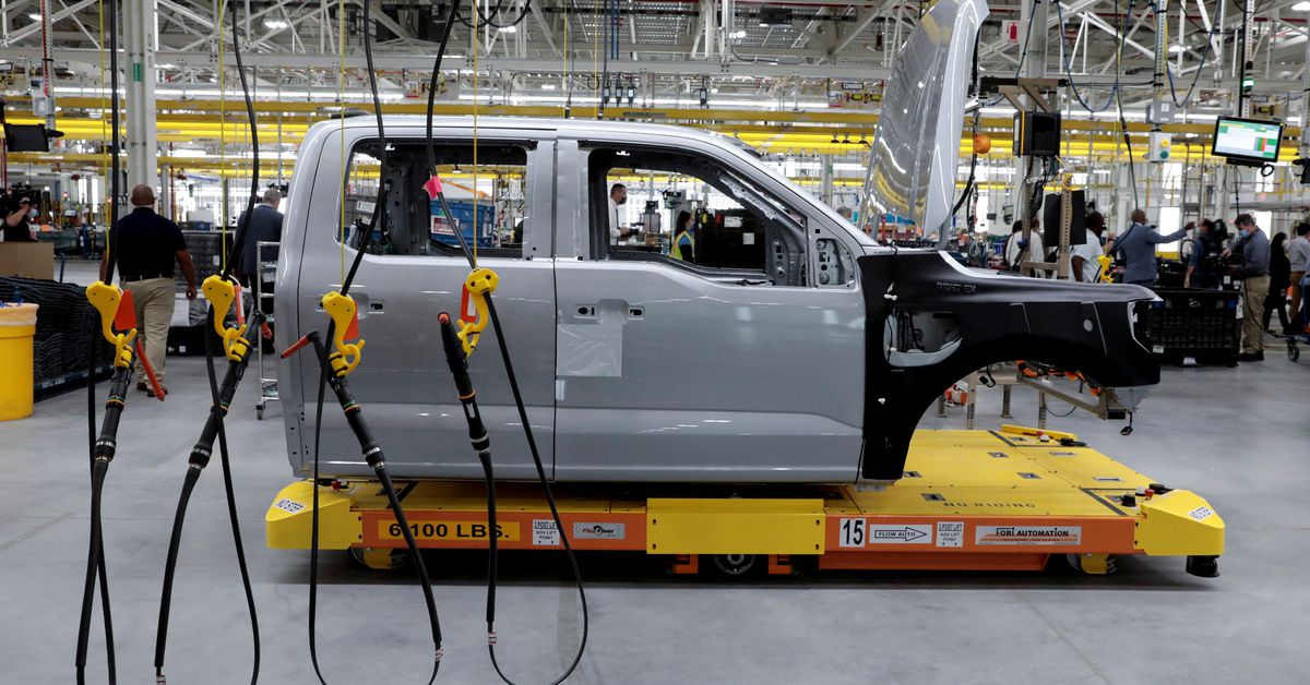 "US EV Sales Battle: Tesla's Rivals Fight for Market Share"