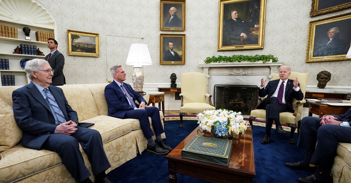 Biden navigates US debt ceiling talks amidst legal and financial risks.