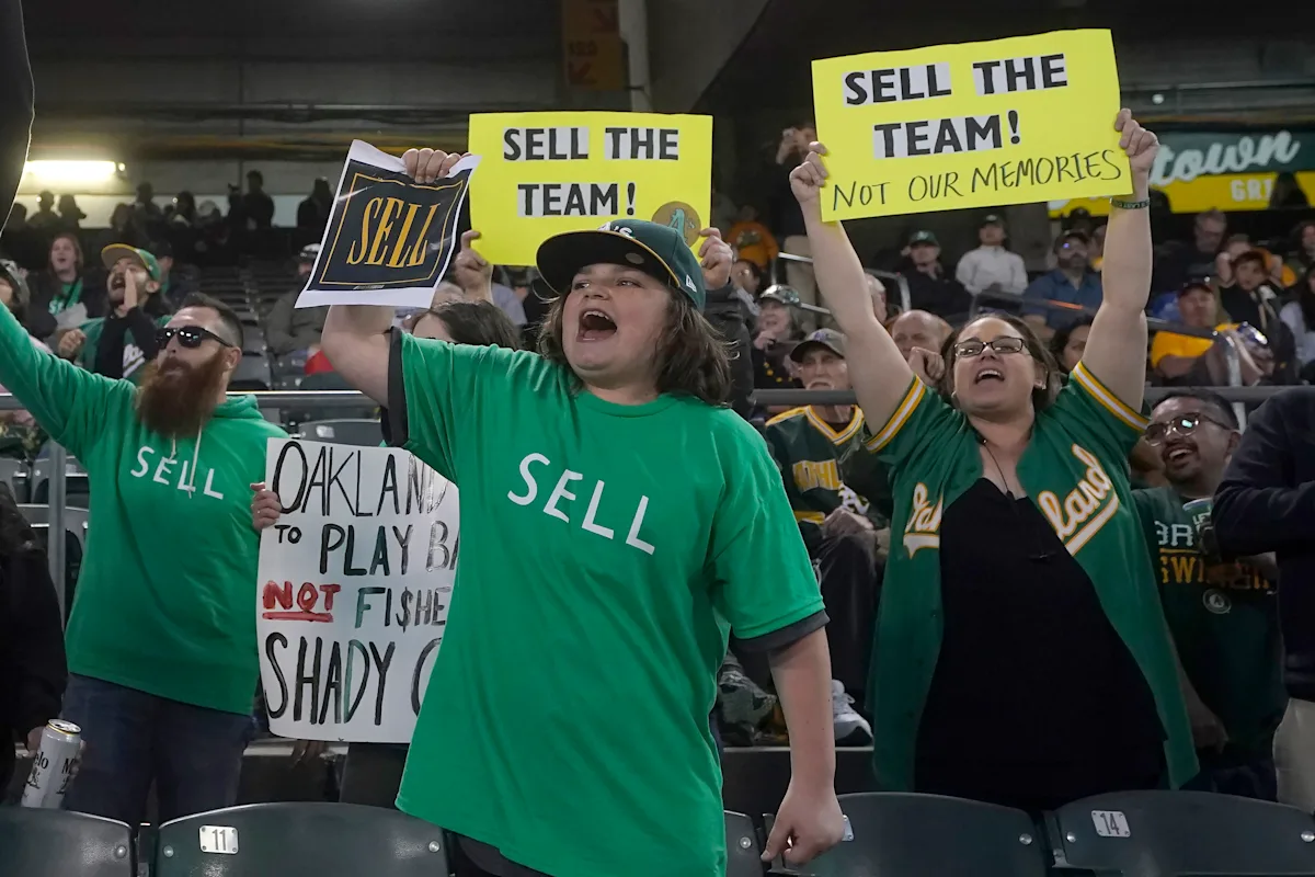 'SELL' shirt worn by Athletics fans headed to Baseball Hall of Fame