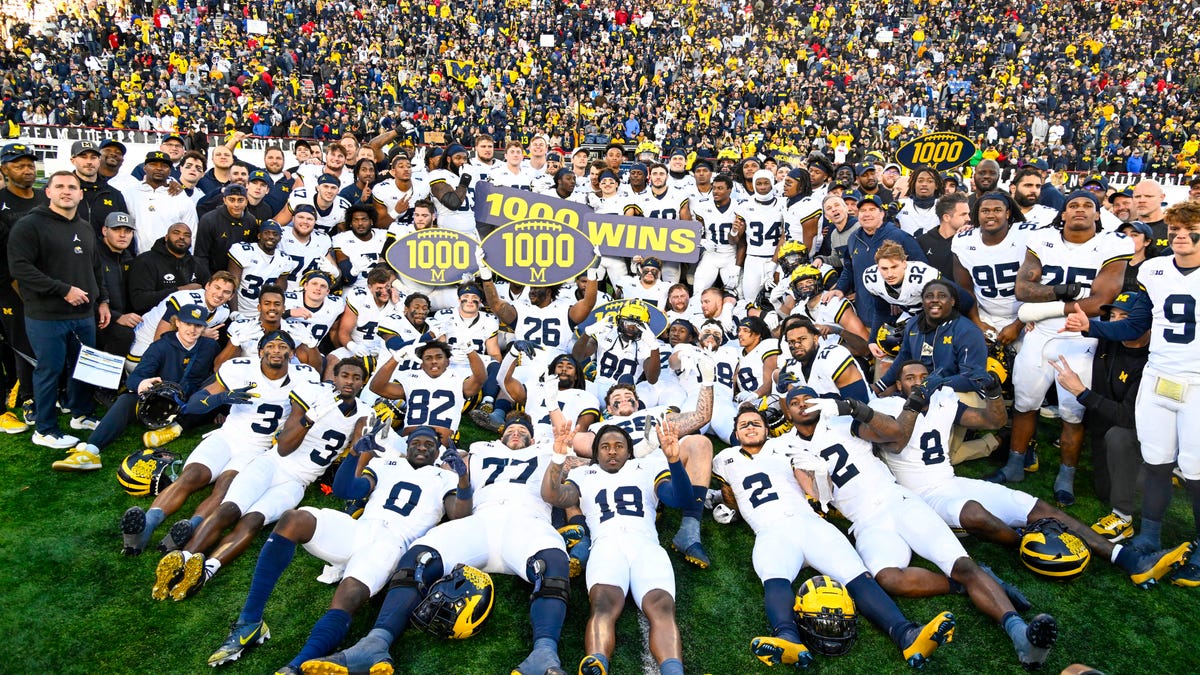 "Undefeated Michigan Eyes Victory in Expanded College Playoff Amidst Scandal and Criticism"