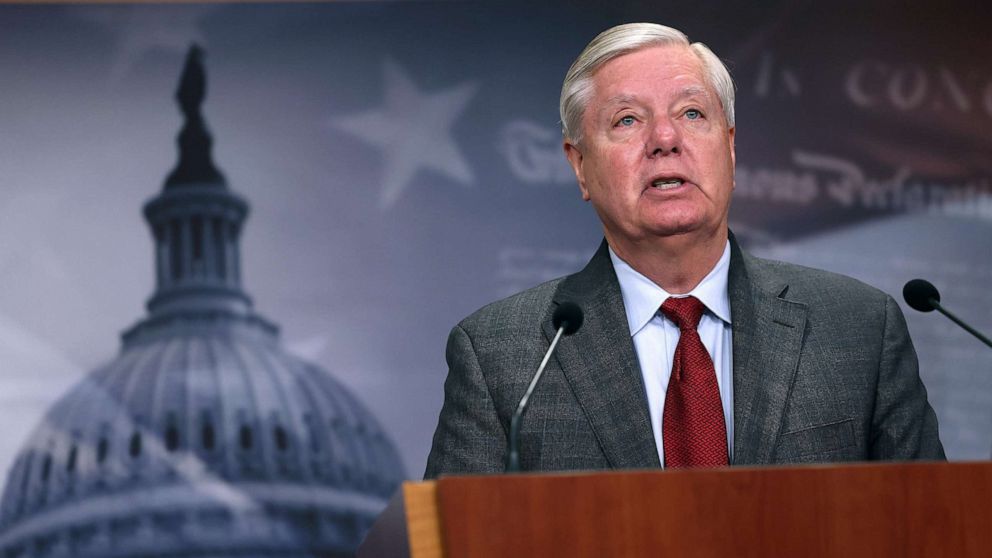 Lindsey Graham defends Trump's strength amidst indictments in heated exchange.