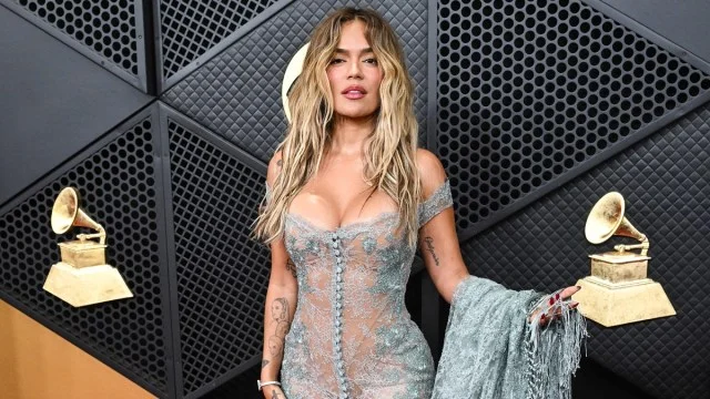 Karol G Wows Grammys Red Carpet in a Dramatic Blue Lace Gown