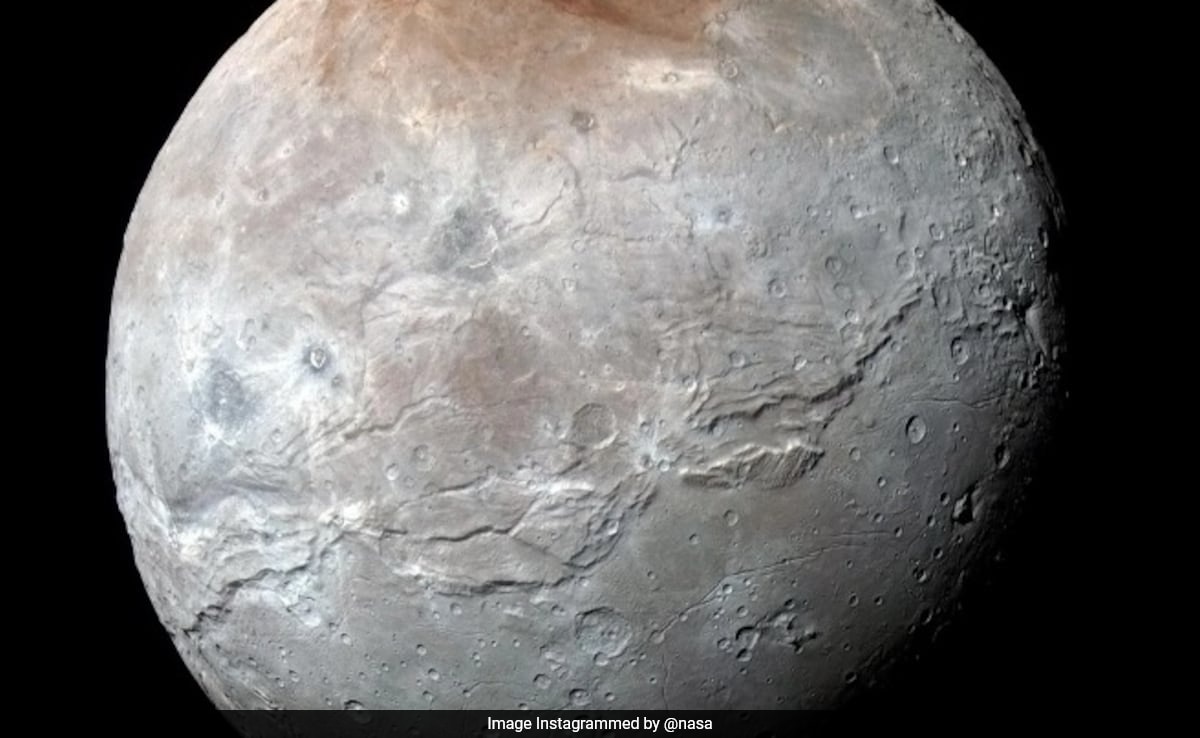 Featured image for "NASA Reveals Stunning Image of Pluto's Moon Charon"