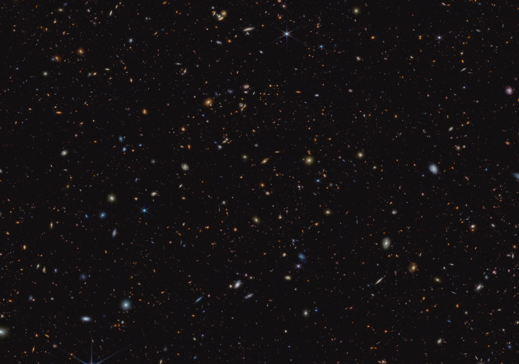 Webb Telescope reveals star formation bursts in early universe.