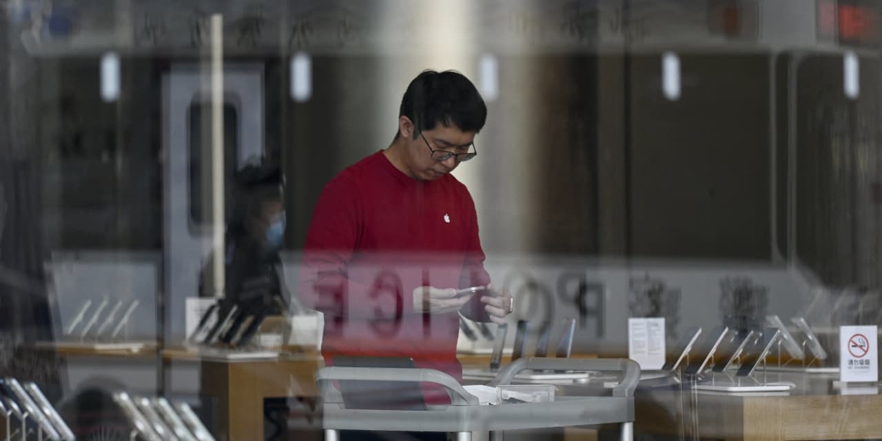 Featured image for "China's Growing Troubles Pose Threat to Apple and Tesla Investments"