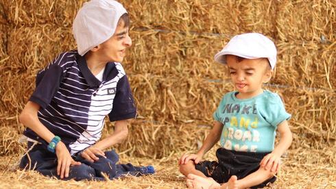 Israeli mother defies odds and cherishes time with sons suffering from progeria syndrome.