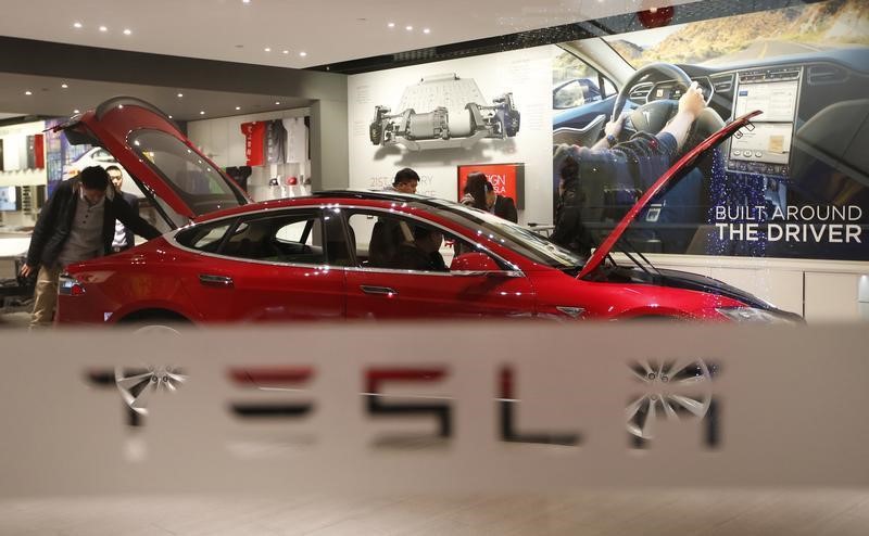 Featured image for Tesla Stock Soars: Analysts Predict $500 Target Amid Record Highs