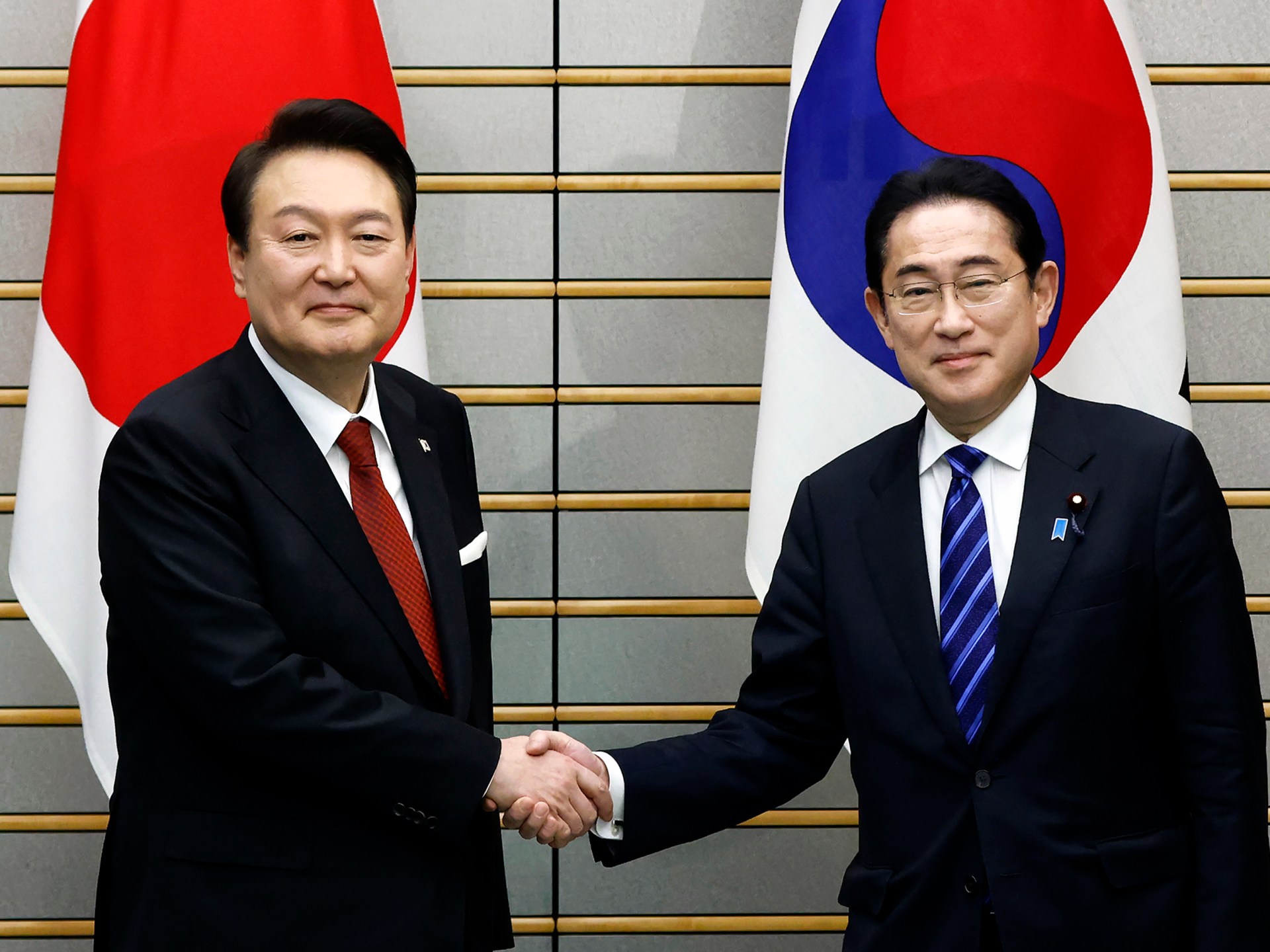 South Korea reinstates Japan to trade white list in thawing relations.