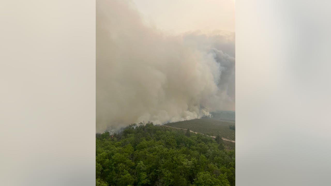 Featured image for Wildfire prompts evacuations in Grayling, Michigan.