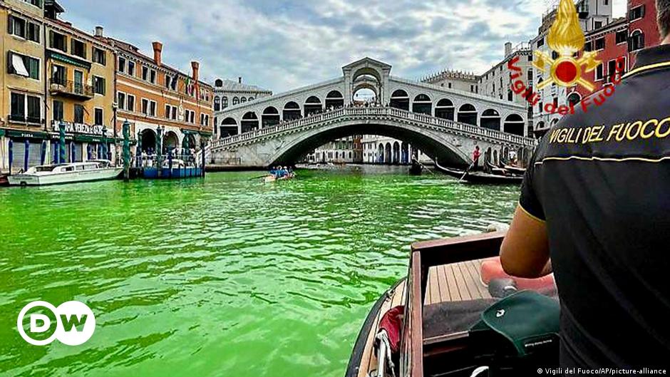 Featured image for Venice's Grand Canal turns fluorescent green, authorities investigate.