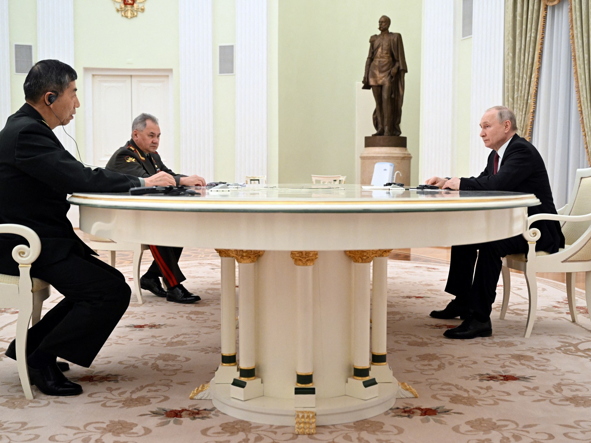 Putin and China's Defense Minister Celebrate Military Cooperation in Moscow